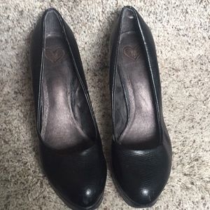 Black leather pumps